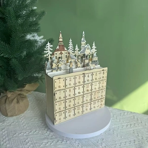 Detail of laser-cut wooden advent calendar featuring a 3D village scene and numbered drawers