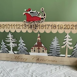 Wooden Christmas advent calendar with Santa sleigh and carved village scene detail