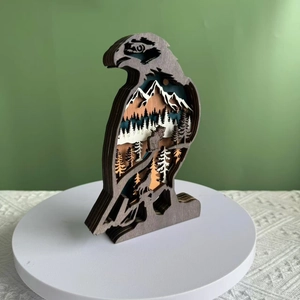 Handcrafted 3D multi-layer eagle wood carving featuring forest and mountain landscape