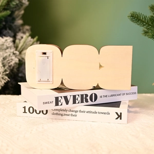 Halloween BOO wooden light ornament with battery box on festive background