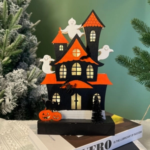 Detail of Halloween LED wooden ghost castle with glowing windows and spooky elements