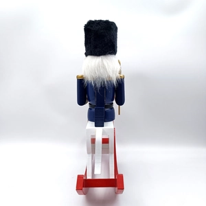 Rear view of 30.5cm wooden nutcracker soldier on rocking horse with white faux hair detail