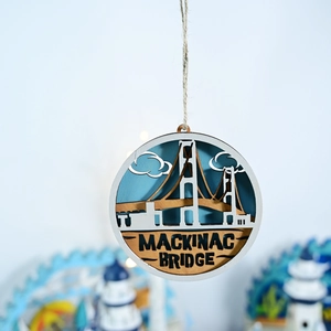 Detail of Mackinac Bridge laser-cut layered wood wall decor with nautical blue sky
