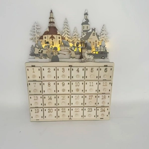 Close-up of wooden Advent Calendar with 24 small drawers and illuminated snow scene village