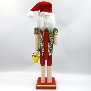 Side view of a Hawaiian Santa nutcracker in tropical shirt with a small yellow bucket