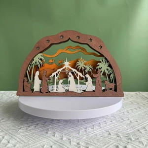 Détail de la crèche de Noël multicouche en bois avec des silhouettes découpées au laser