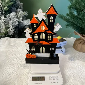 Weight measurement of glowing Halloween wooden castle ghost decoration at 126.5 grams