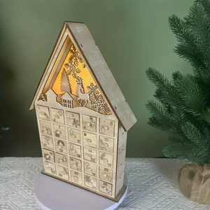 Détail du calendrier de l'Avent en bois avec 25 tiroirs et silhouette LED chaude