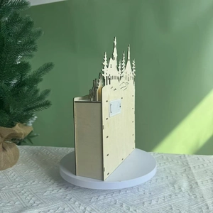 Detailed back view of wooden Christmas advent calendar with battery compartment and house silhouette