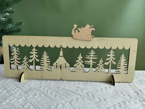 Detail of wooden Christmas advent calendar featuring laser-cut winter village scenery