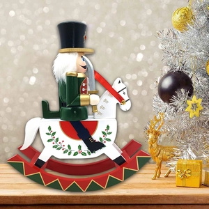 Close-up of wooden nutcracker soldier on a rocking horse with festive Christmas decor