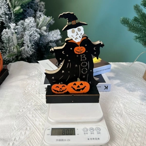 Detailed view of Halloween skeleton figurine with pumpkin base showing 80g product weight