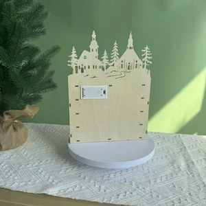 Rear view of wooden Christmas advent calendar box showing battery compartment and LED switch