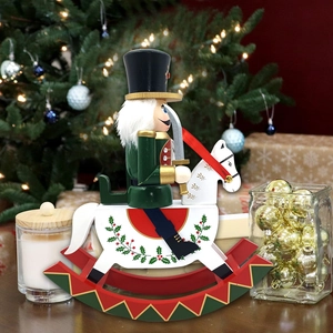 Detail of traditional wooden nutcracker soldier on white rocking horse for Christmas decor