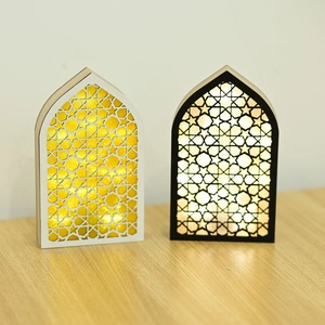 Close-up of laser-cut wooden Eid LED lights with intricate Islamic geometric patterns