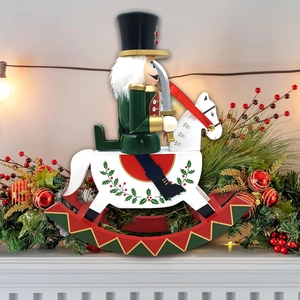 Close-up of traditional nutcracker soldier on rocking horse with festive Christmas decor