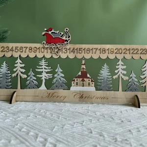 Wooden Christmas advent calendar with sliding Santa sleigh and laser-cut forest landscape