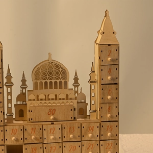 Detail of wooden Ramadan countdown calendar featuring laser-cut Islamic architecture art