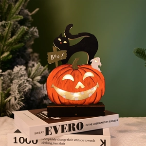 Detail of wooden Halloween LED ornament with glowing pumpkin, black cat, and Boo sign