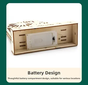 Detail view of the wooden moon lamp base featuring a battery compartment and power switch