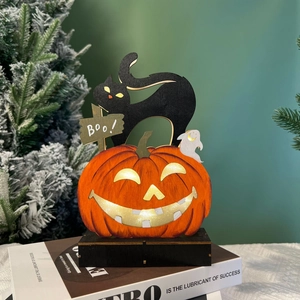 Close-up of LED wooden Halloween decor with glowing pumpkin, black cat, and ghost