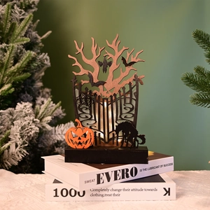 Macro detail of Halloween wooden LED decor with layered silhouettes of bats and castles