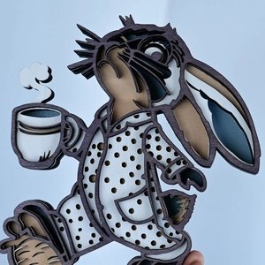 Detailed view of 3D layered wooden bunny decoration with coffee cup for Easter