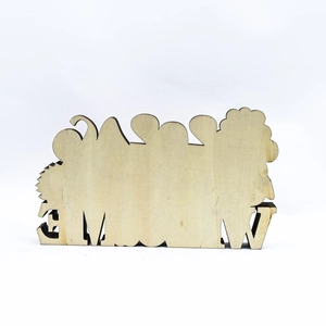 Detailed close-up of a laser-cut wooden mushroom ornament with a natural grain finish