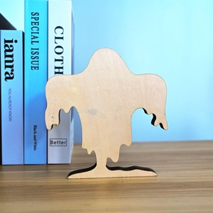 Detail of creative ghost-shaped wooden Halloween ornament with natural wood grain texture
