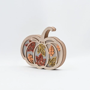 LED wooden pumpkin decoration with fall maple leaves and warm glowing lights