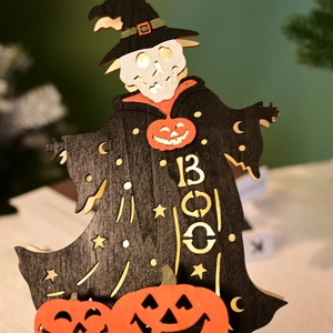 Close-up of wood Halloween skeleton decoration with LED pumpkin and Boo text