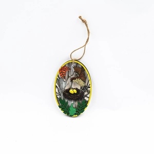 Hanging wooden Easter ornament with multilayer bird and forest nest carving detail