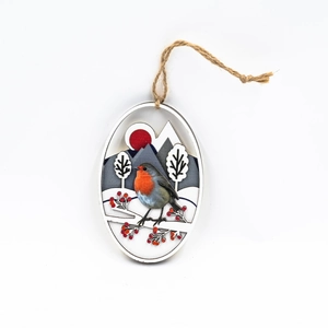 Detail of wooden bird pendant showing robin with red berries on an oval wood grain slice
