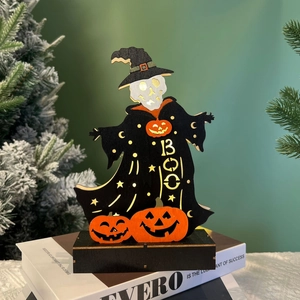 Close-up of Halloween wooden ghost decoration with pumpkin and BOO lettering