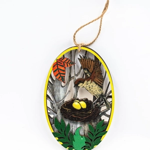 Wooden round spring bird ornament with nest and leaves hanging on natural jute rope
