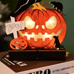 Macro shot of Halloween LED wooden pumpkin lamp with Boo sign and witch hat detail