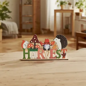 Detail of wooden Harvest table decor featuring squirrel, hedgehog and autumn gnome characters