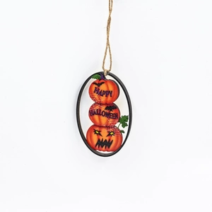 Detail of wooden Halloween pumpkin hanging decor with spider web and bat patterns