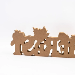 Detail of wooden Teach desktop ornament with autumn maple leaf accents and smooth edges