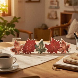 Macro detail of multi-colored wooden maple leaf ornaments with intricate carved textures
