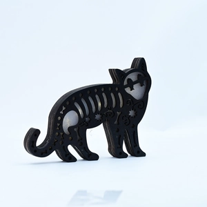 Detailed laser-cut black cat wooden decoration with intricate Halloween patterns