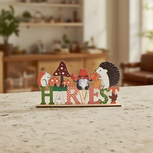 Close-up of wooden HARVEST sign with cute autumn squirrel, gnome and hedgehog details