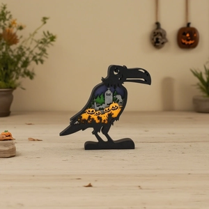 Detailed close-up of LED glowing raven wood carving with spooky pumpkin and graveyard scene