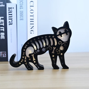 Halloween black wooden cat silhouette light with hollow bone patterns and warm LED glow