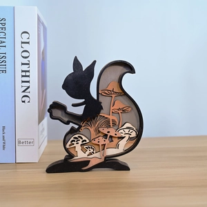 Detail of multi-layered wood carved squirrel sculpture with forest mushroom scenery