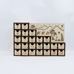 Detail of wooden advent calendar with 24 numbered drawers and Nativity scene silhouette