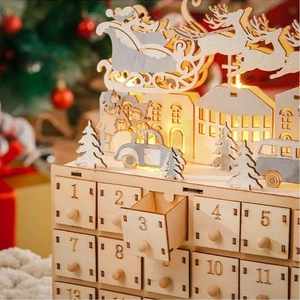 Wooden 24-day advent calendar with LED lights featuring Santa's sleigh and reindeer