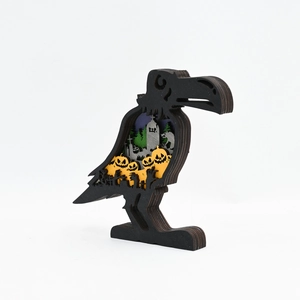 Detailed layered wood raven carving with graveyard scene and pumpkins for Halloween decor
