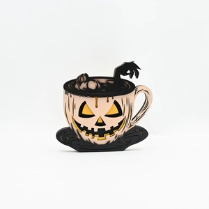 Macro view of multi-layer laser cut wooden coffee cup pumpkin for Halloween decor