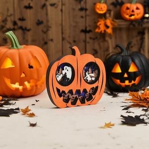 3D layered wooden Halloween pumpkin ornament with ghosts, witch, and bats carving